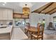 Cozy dining area featuring a breakfast nook with a light fixture and views of the outdoor pool at 2007 Manassas Dr, Woodstock, GA 30189