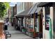Charming downtown shops with awnings and inviting storefronts line the pedestrian-friendly streets at 2007 Manassas Dr, Woodstock, GA 30189