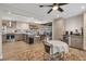 Open-concept kitchen with stainless appliances, custom cabinets, and an adjacent dining area at 2007 Manassas Dr, Woodstock, GA 30189