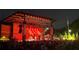 Large outdoor stage illuminated for a concert at night in a vibrant community setting with attendees at 2007 Manassas Dr, Woodstock, GA 30189