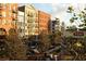Town center featuring apartments, shops, and tree-lined walkways create a vibrant community atmosphere at 2007 Manassas Dr, Woodstock, GA 30189