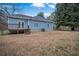 A nice sized backyard features a deck area with a lush lawn, great for outdoor activities at 2820 Maxwell Pl, Lithia Springs, GA 30122