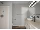 Bathroom featuring a modern vanity, a shower with blue tape, and wood-look flooring at 2820 Maxwell Pl, Lithia Springs, GA 30122