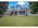 Attractive home with a classic covered porch, offering curb appeal and outdoor living space at 2820 Maxwell Pl, Lithia Springs, GA 30122