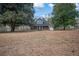 Charming two-story home featuring a welcoming front porch and surrounded by mature trees at 2820 Maxwell Pl, Lithia Springs, GA 30122