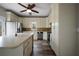 Bright kitchen featuring an island, stainless steel appliances, and tile backsplash at 2820 Maxwell Pl, Lithia Springs, GA 30122