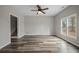 Open living room features wood flooring, neutral paint, and lots of natural light at 2820 Maxwell Pl, Lithia Springs, GA 30122