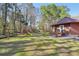 Sprawling backyard featuring a playground set, perfect for outdoor fun and activities at 4805 Mystere Sw Ln, Lilburn, GA 30047