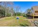 Large backyard with a swing set, offering ample space for recreation and relaxation at 4805 Mystere Sw Ln, Lilburn, GA 30047