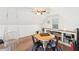 Light-filled bonus room or playroom with a vaulted ceiling, hardwood floors, and a hanging chair at 4805 Mystere Sw Ln, Lilburn, GA 30047