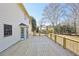 New deck features an open layout with views of the large, private yard at 4805 Mystere Sw Ln, Lilburn, GA 30047