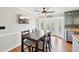 This eat-in dining area has hardwood floors, and french doors to the outdoor deck at 4805 Mystere Sw Ln, Lilburn, GA 30047