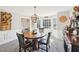 Inviting dining room features a bay window, decorative chandelier, and convenient wine storage at 4805 Mystere Sw Ln, Lilburn, GA 30047