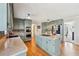 Beautiful kitchen features custom cabinets, stainless appliances, tile backsplash, and center island at 4805 Mystere Sw Ln, Lilburn, GA 30047