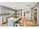 Modern kitchen with stainless steel appliances, a center island, and beautiful hardwood floors at 4805 Mystere Sw Ln, Lilburn, GA 30047