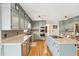 Stylish kitchen with stainless steel appliances, a center island, and ample cabinet space at 4805 Mystere Sw Ln, Lilburn, GA 30047