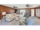 Comfortable living room featuring wood paneling and stylish furnishings at 4805 Mystere Sw Ln, Lilburn, GA 30047