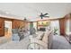 Cozy living room with fireplace, wood trim and lots of seating at 4805 Mystere Sw Ln, Lilburn, GA 30047