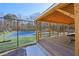 Covered viewing platform with a great view of the fenced tennis court at 4805 Mystere Sw Ln, Lilburn, GA 30047