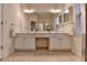 Spacious bathroom featuring a double vanity with ample counter space and storage cabinets at 1635 Vinery Ave, Cumming, GA 30041