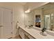 Bathroom vanity with a double sink and a large mirror, providing ample counter space and storage at 1635 Vinery Ave, Cumming, GA 30041