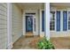 Welcoming front entrance with sidelights and a 'welcome' mat, framed by decorative pillars at 1635 Vinery Ave, Cumming, GA 30041