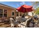 Outdoor patio with plentiful seating, large umbrella and outdoor grill, perfect for entertaining and relaxation at 244 Amelia Garden Way, Lawrenceville, GA 30045