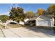 Well-kept home exterior featuring a spacious driveway and lush green front yard at 244 Amelia Garden Way, Lawrenceville, GA 30045