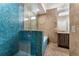 Bathroom featuring blue tiled walk-in shower, tile floors and a tub and shower combo at 322 Gray Shingle Ln, Woodstock, GA 30189