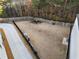 Aerial shot of fenced dog park with artificial turf, a dog walking area, and seating at 322 Gray Shingle Ln, Woodstock, GA 30189