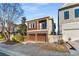 Charming home with a brick driveway and a two-car garage, perfect for urban living at 322 Gray Shingle Ln, Woodstock, GA 30189