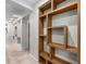 Spacious hallway features built-in display shelves, recessed lighting and neutral carpeting at 322 Gray Shingle Ln, Woodstock, GA 30189