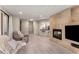 Spacious living room featuring a fireplace, modern lighting, and comfortable seating at 322 Gray Shingle Ln, Woodstock, GA 30189