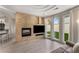 Modern living room with fireplace, tiled wall feature, and natural light at 322 Gray Shingle Ln, Woodstock, GA 30189