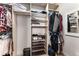 Well-organized walk-in closet with shelves, hanging rods, and shoe racks providing ample storage space at 322 Gray Shingle Ln, Woodstock, GA 30189