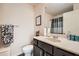 Well-lit bathroom with a single vanity, modern fixtures, a toilet, and a stylish shower curtain, offering a clean design at 3362 Brockenhurst Dr, Buford, GA 30519