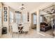 Cozy dining area featuring a round table, stylish chairs, and large windows for natural light at 3362 Brockenhurst Dr, Buford, GA 30519