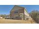 Rear exterior view of the townhome with a fenced-in yard and patio at 3362 Brockenhurst Dr, Buford, GA 30519