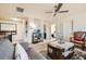 Cozy upstairs living room showcasing neutral carpet, a ceiling fan, comfortable seating, and an elegant decorative design at 3362 Brockenhurst Dr, Buford, GA 30519