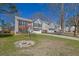 Suburban home with a well-manicured lawn and long driveway leading to a two-car garage at 361 Fountainmist Trl, Lawrenceville, GA 30043