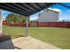 View of the fenced-in backyard with the house in the background at 6279 Nellie Se Br, Mableton, GA 30126