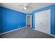 A bright blue bedroom with carpet, closet and a window at 6279 Nellie Se Br, Mableton, GA 30126