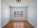 Bright dining room featuring hardwood floors, large windows, and modern light fixture at 6279 Nellie Se Br, Mableton, GA 30126