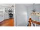 View of a white painted foyer and stairway visible from the adjacent updated kitchen at 6279 Nellie Se Br, Mableton, GA 30126