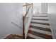 Stairway with wood stairs and white risers, leading upwards at 6279 Nellie Se Br, Mableton, GA 30126