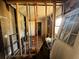 An incomplete interior space, framing and pipes exposed offering a glimpse into the renovation process at 193 Berean Se Ave, Atlanta, GA 30316