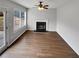 Neutral living room featuring a fireplace and sliding glass door to the backyard at 3745 Talbot Nw Ln, Acworth, GA 30101