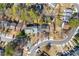 An overhead view of townhomes with tree lined streets and manicured landscaping at 5043 Bell Dr, Smyrna, GA 30080