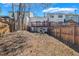 Wide backyard with a wooden fence overlooking back of home with deck and trees at 5043 Bell Dr, Smyrna, GA 30080