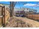 The backyard features a wooden fence, a raised deck, and lush greenery at 5043 Bell Dr, Smyrna, GA 30080